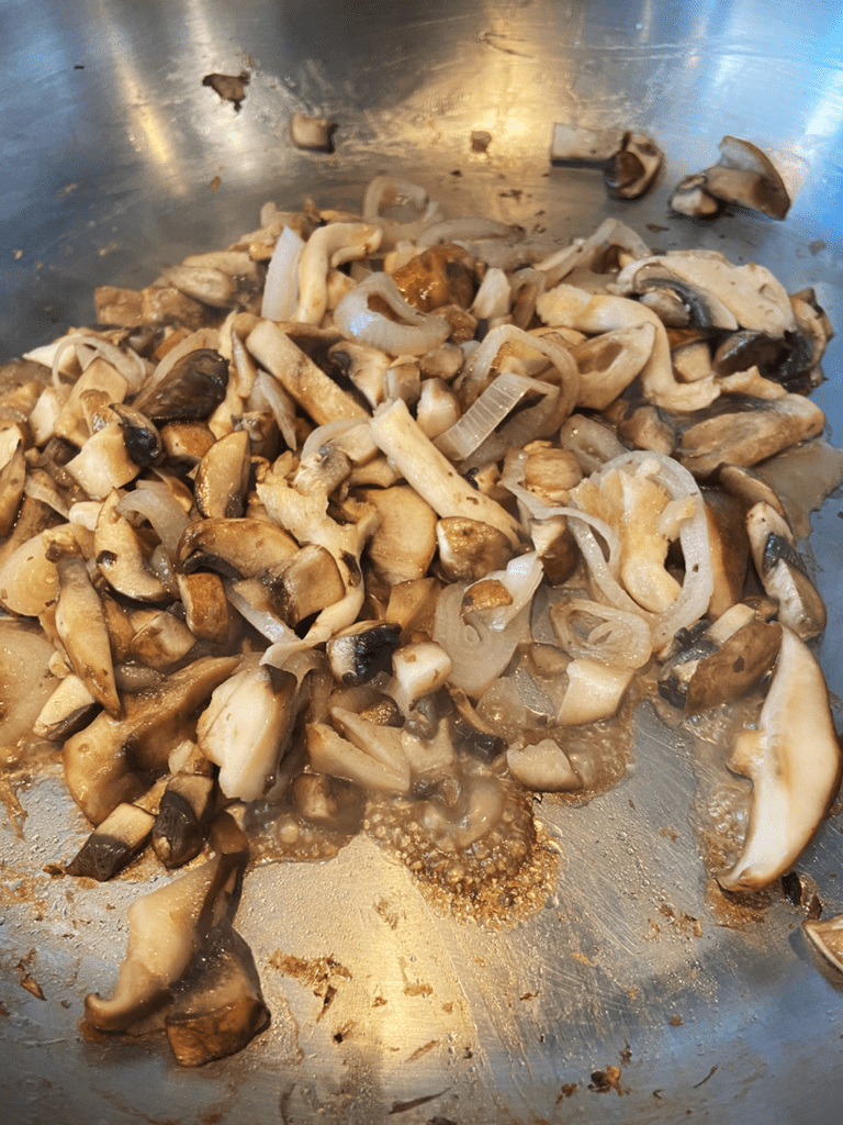 mushrooms and shallots in a skillet