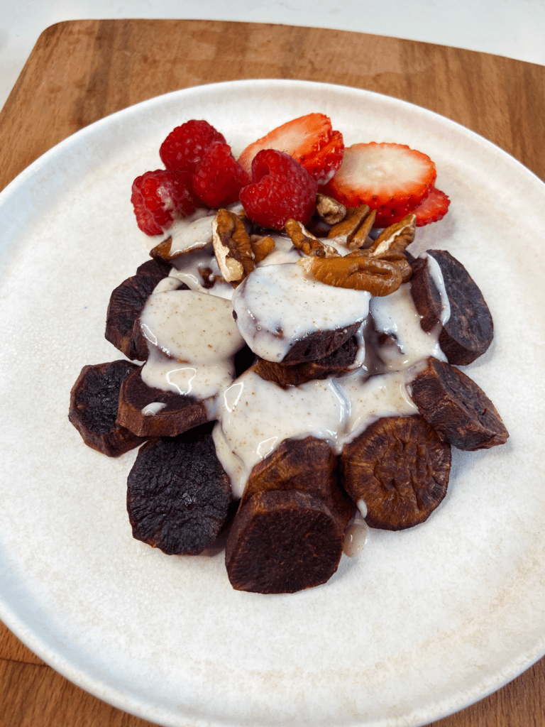 Breakfast Air Fryer Purple Potatoes with fresh fruit and a sweet vanilla vegan yogurt sauce