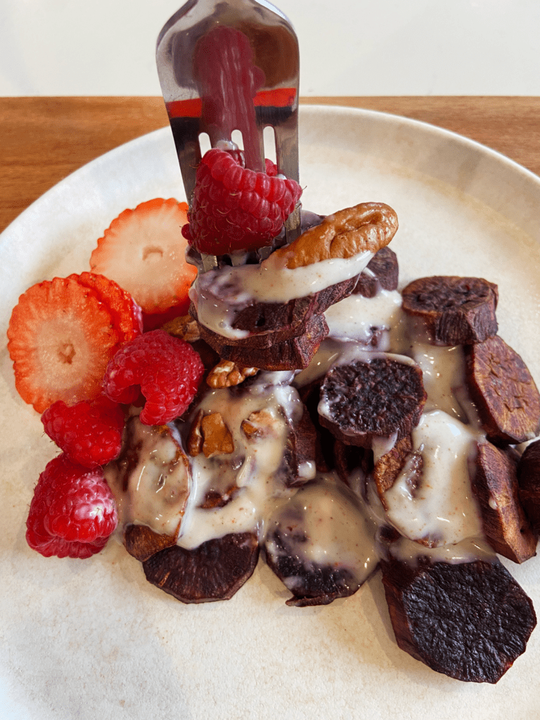 Breakfast Air Fryer Purple Potatoes with fresh fruit and a sweet vanilla vegan yogurt sauce