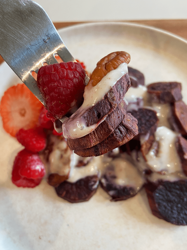 Breakfast Air Fryer Purple Potatoes with fresh fruit and a sweet vanilla vegan yogurt sauce