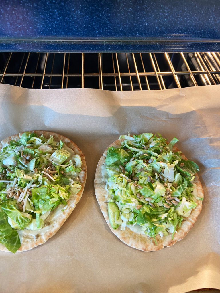 vegan brussels sprouts caesar pita pizza in the pizza