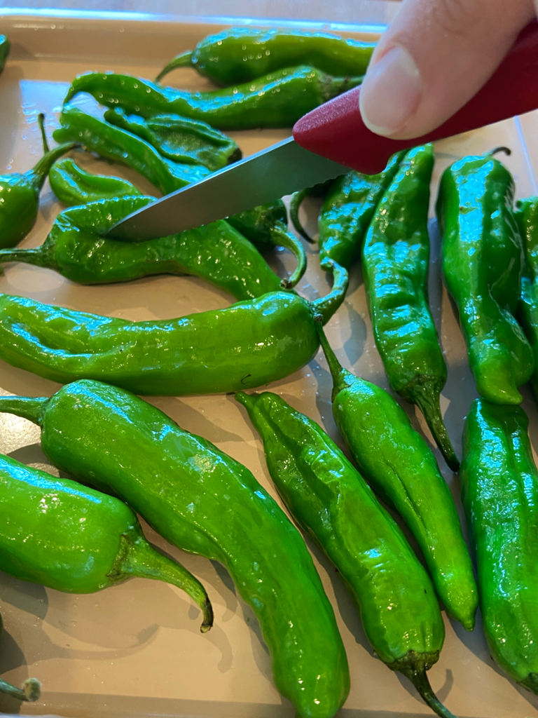 cutting slits in shishito peppers