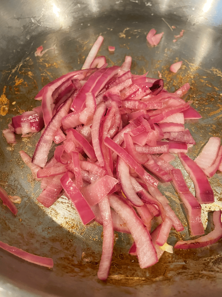 fast pickled red onions cooked in a pan