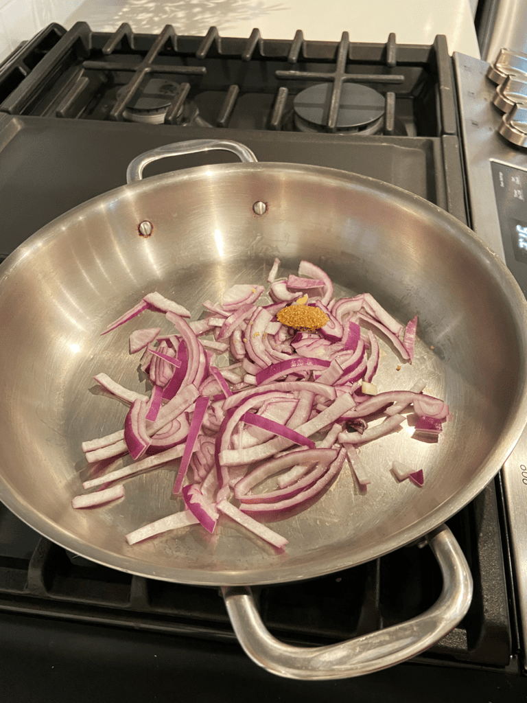 ingredients for fast pickled red onion in a pan