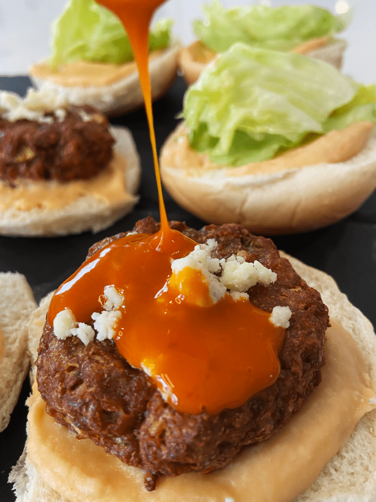 vegan buffalo blue sliders with vegan meat substitutes 