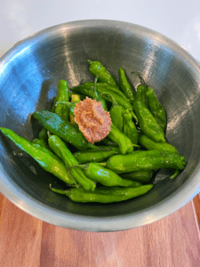 miso and shishito peppers in a bowl