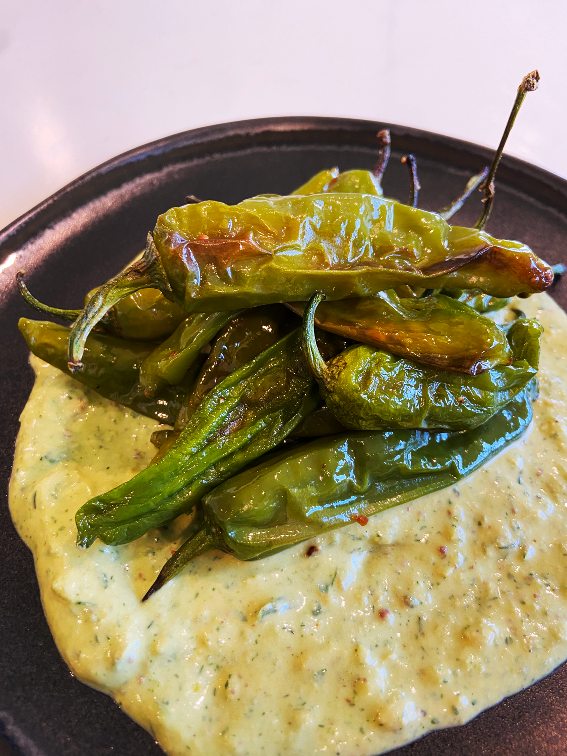 AIR FRYER SHISHITO PEPPERS WITH LEMON HERB TAHINI DIP