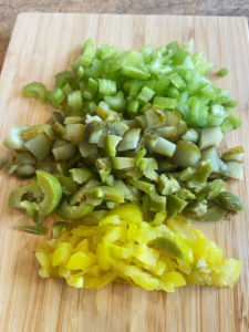 chopped olives, celery, pickles, and banana peppers