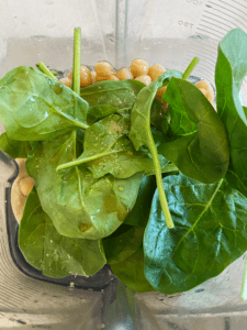 ingredients for sweet pistachio tahini vegan fruit dip in a blender